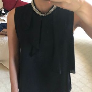 sheer black ruffled top with bejeweled collar